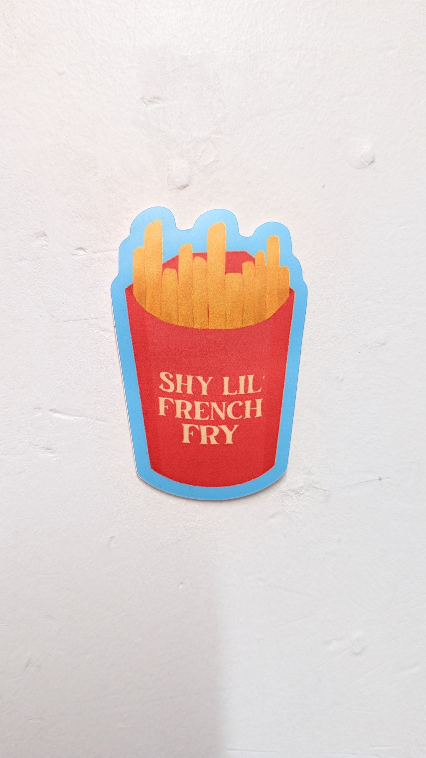 Sticker of a red bucket with french fries and 'SHY LIL FRENCH FRY' text on a white background